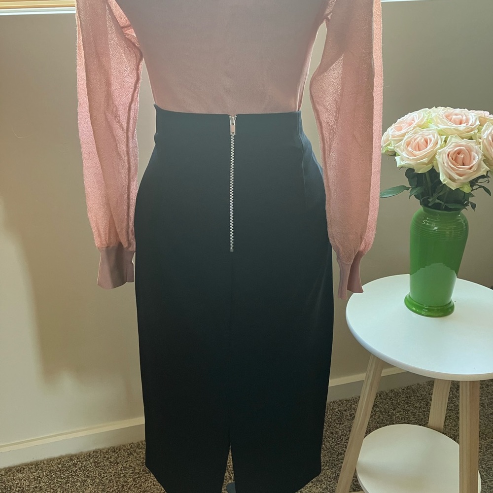 Perfect little, black pencil skirt. High waisted with statement back zipper.